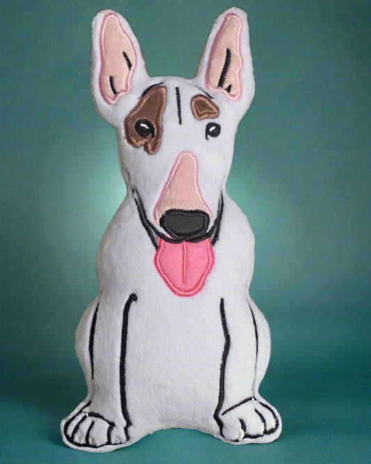 This is a  bull terrier dog  stuffed toy . It's white with brown eye patches and a pink nose. Made by not your nana in Dunedin, new Zealand.
