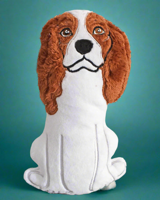 This is a Spaniel soft toy with soulful eyes. It is black, white or brown. Made by Not your Nana in Dunedin, New Zealand.