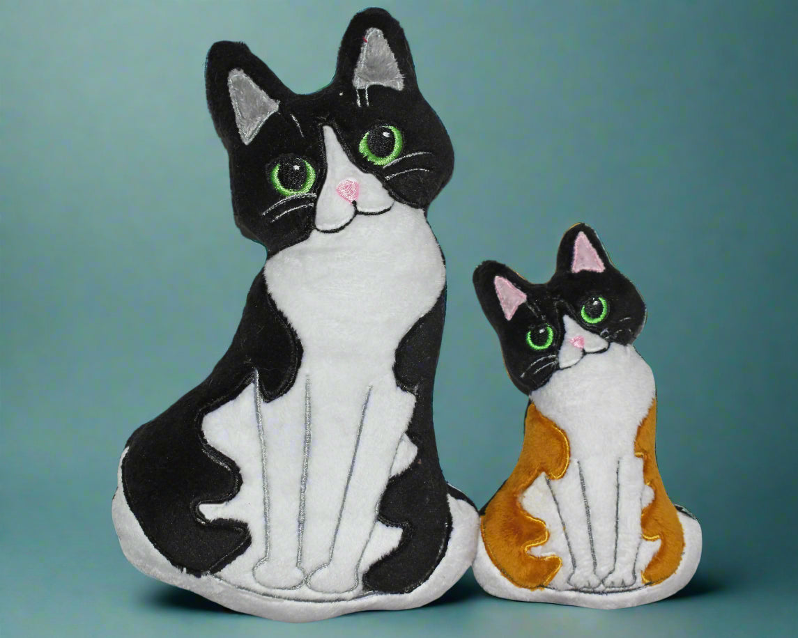 This is soft toy cat with a sweet expression They come in a variety of colours. Proudly made by not your nana in Dunedin, New Zealand.