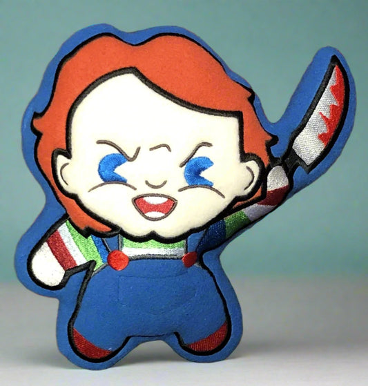 Cartoon Chucky character with red hair, blue eyes, and a knife made By Not Your Nana, Dunedin, New Zealand