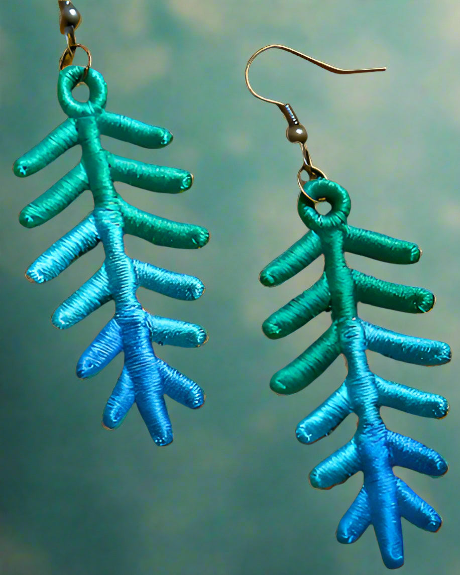 These are made with thread only (no fabric). They are in shades of blue and green and have hypoallergenic hooks. Made by Not Your Nana in Dunedin, New Zealand.