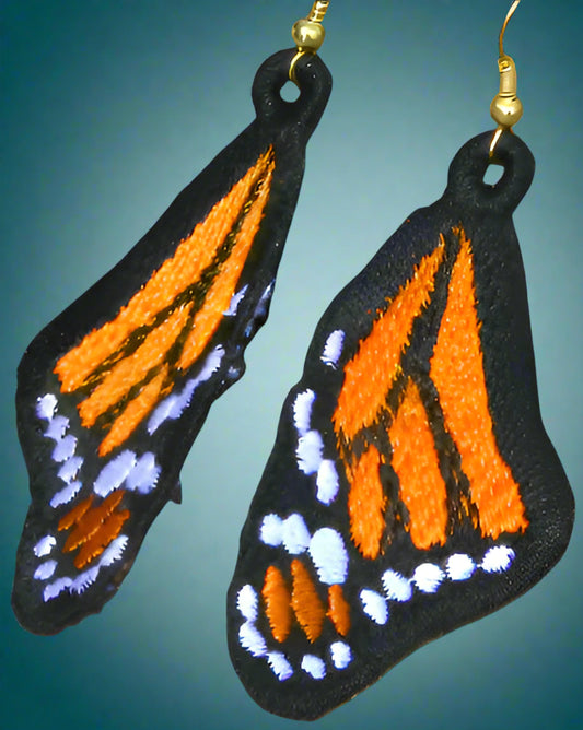 These dangly monarch butterfly earrings are in the classic monarch colourway of orange, yellow, black and white. They are handmade from thread and hypoallergenic hooks. Made by Not Your Nana in Dunedin, New Zealand.