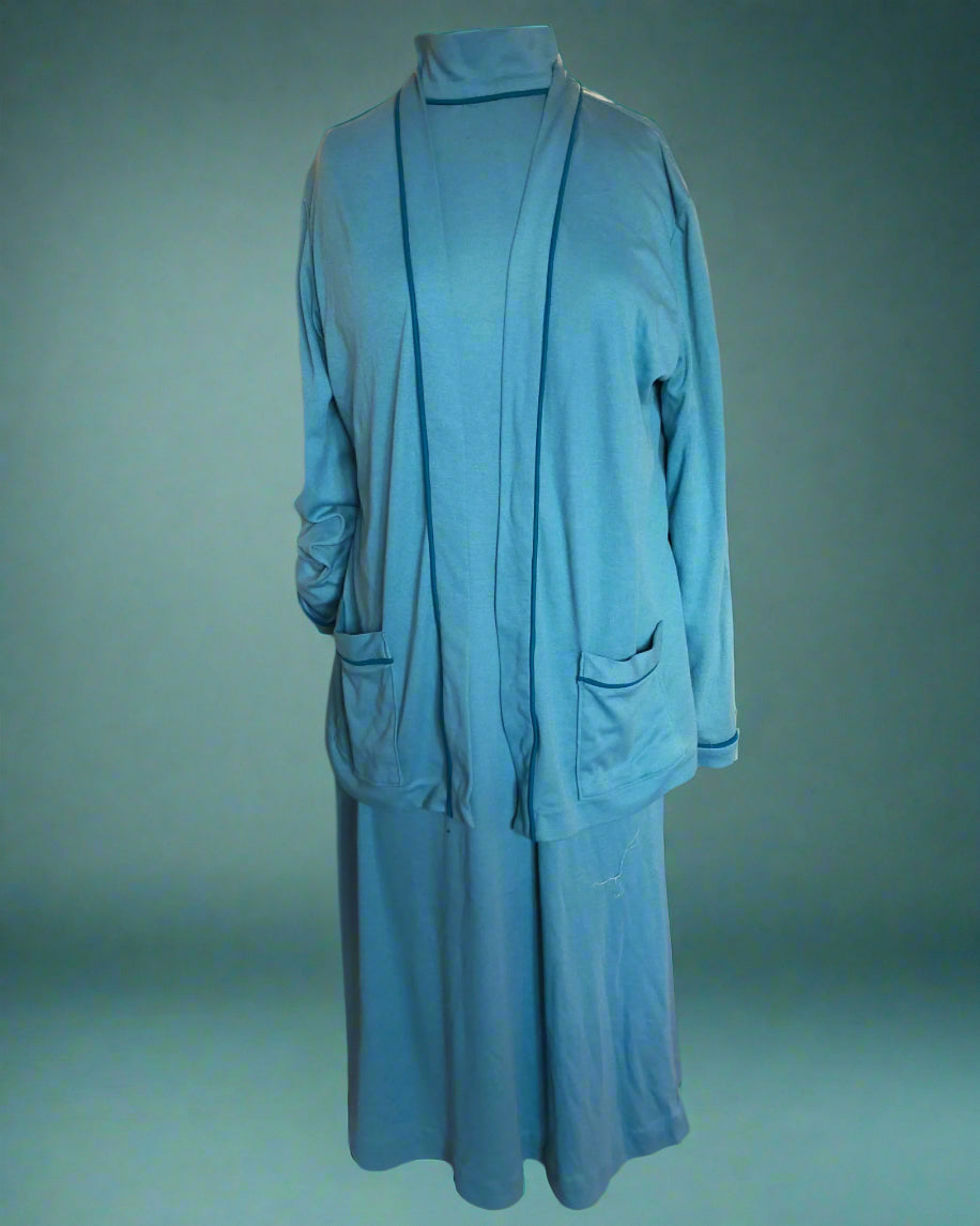 This is a blue knit dress and jacket ensemble. Features include piping and pockets