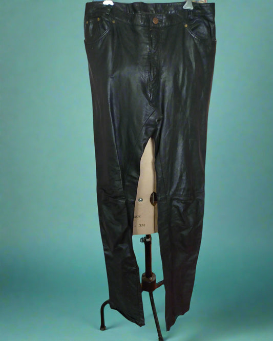 This is a pair of black leather trousers in the style of jeans. Found by Not Your Nana in Dunedin, New Zealand