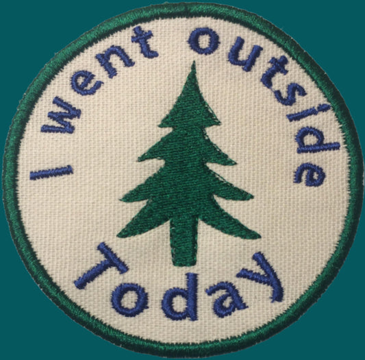 This is a patch with an outline of a pine tree and the words "I went outside today".  Made by Not Your Nana in Dunedin, New Zealand