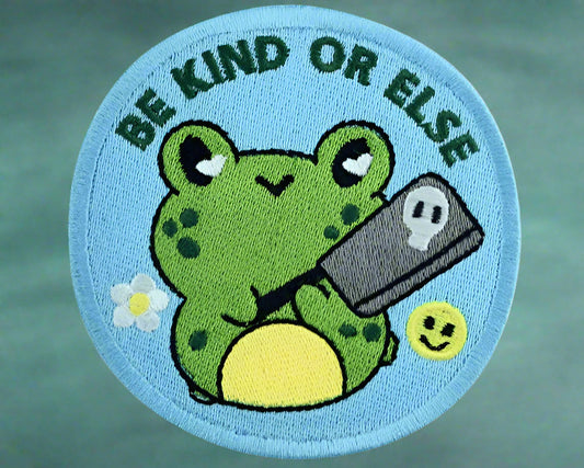 Circular patch with a frog design and text 'Be Kind or Else'. Made by Not Your Nana, Dunedin, New Zealand