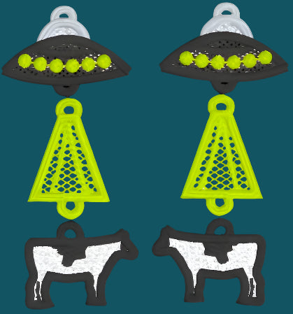 A pair of embroidered thread earrings in 3 parts depicting a cow being abducted by an alien. Handmade in Dunedin, New Zealand