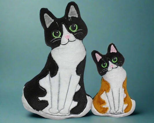 This is  soft toy cat with a sweet expression They come in a variety of colours. Proudly made by not your nana in Dunedin, New Zealand.