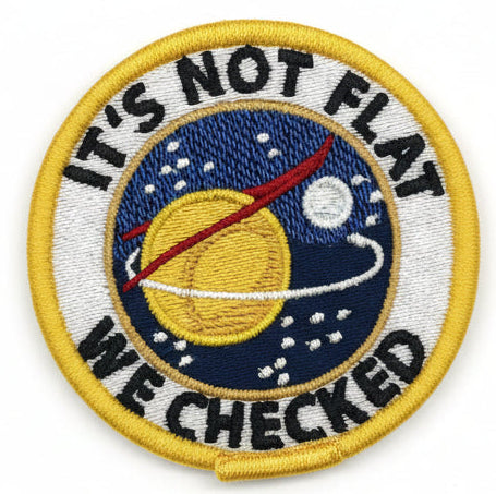 Embroidered patch with space theme and text 'It's not flat, we checked' on a white background
