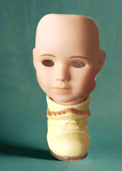 Porcelain doll head tealight on vintage ceramic boot. Made by Not You Nana in Dunedin, New Zealand,