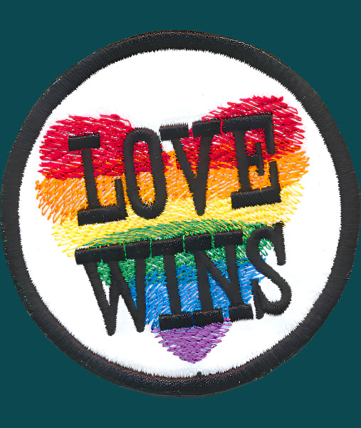 this is a pride patch. I has a rainbow heart with the words "Love wins" over it. Made by Not Your Nana In Dunedin, New Zealand.