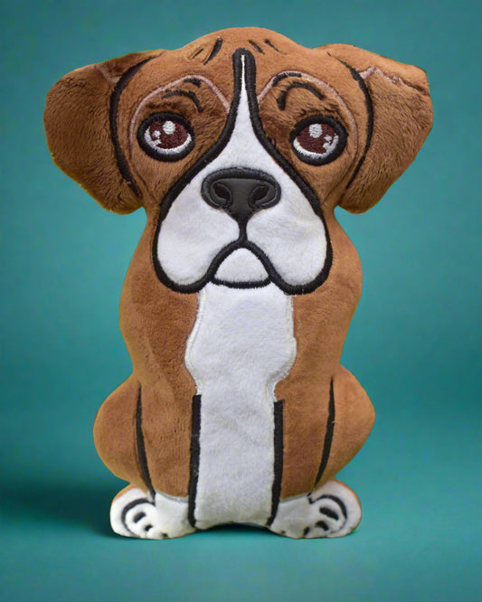 This is  Boxer dog soft toy. It is tan and white with sad eyes. Made by Not Your Nana in Dunedin, New Zealand