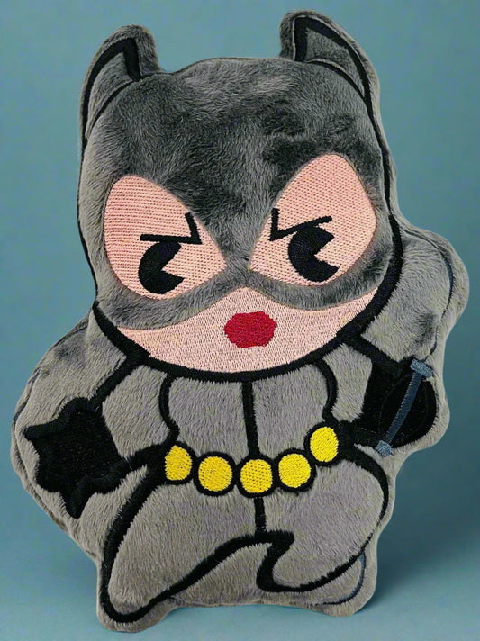 Plush toy shaped like a cat in a superhero costume with a white background