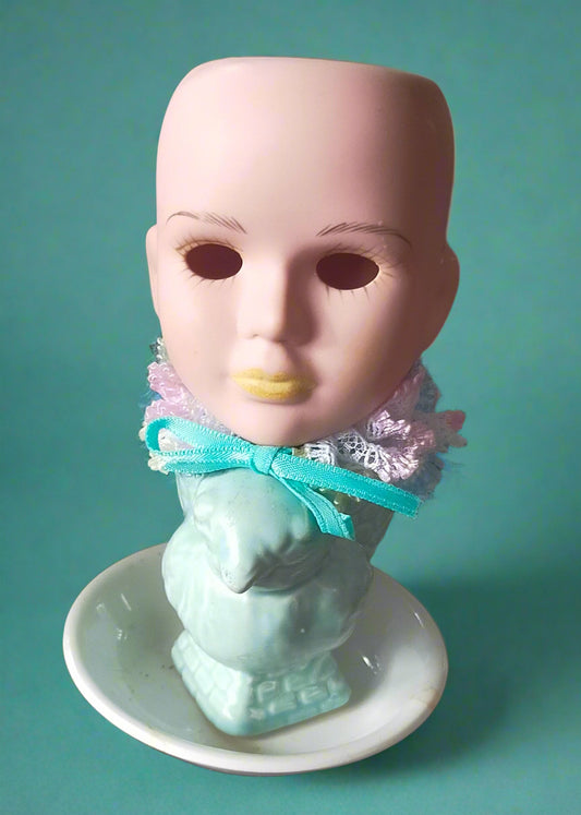 Vintage porcelain doll mounted on a chicken egg cup. Made by Not You Nana in Dunedin, New Zealand,