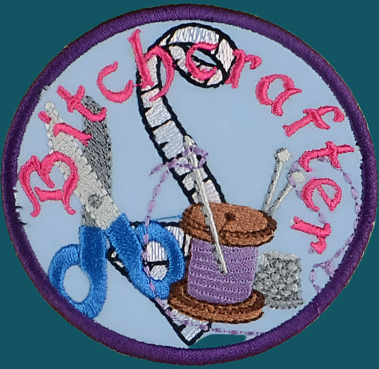 This is an adult merit patch. The image is of sewing tools with the word  btichcrafter printed over it.