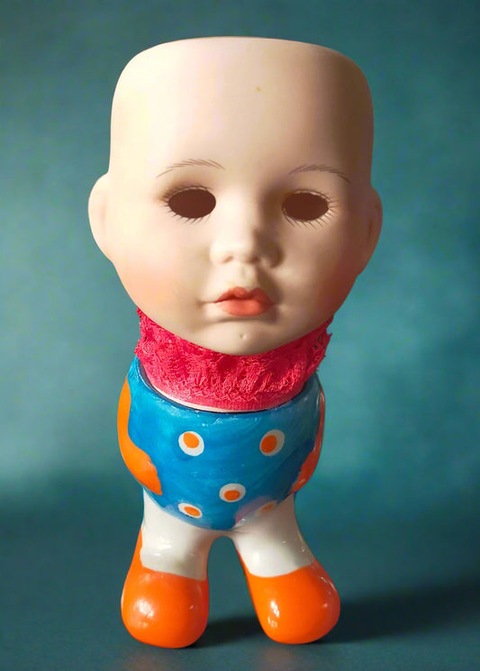 Vintage porcelain doll head teacup with a colourful eggcup.  Made by Not You Nana in Dunedin, New Zealand
