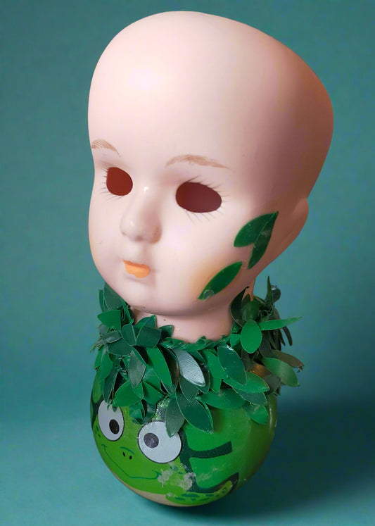 Porcelain head with teacup green body and leaves.  Made by Not You Nana in Dunedin, New Zealand