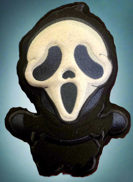 Plush toy (Ghost Killer) featuring a ghost face design. Made by Not Your Nana, Dunedin, New Zealand