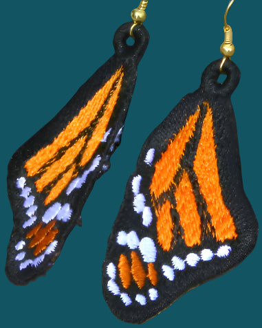 These dangly monarch butterfly earrings are in the classic monarch colourway of orange, yellow, black and white. They are handmade from thread and hypoallergenic hooks. Made by Not Your Nana in Dunedin, New Zealand.