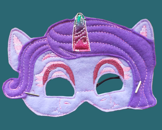 This is a mauve "my little pony unicorn" with a purple mane and pink horn. Mad by Not Your Nana in Dunedin, New Zealand