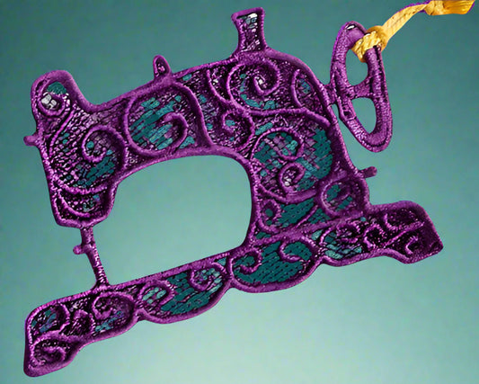 This is a small dangly lace ornament of a sewing machine
