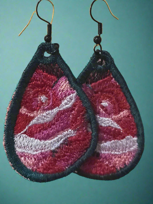 This is a pair of embroidered rose earrings