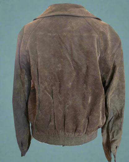 Brown leather jacket on a mannequin against a teal background