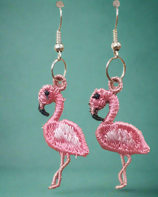 This is a picture of pink embroidered flamingo earrings. Mad by Not Your Nana, dunedin, New Zealand.