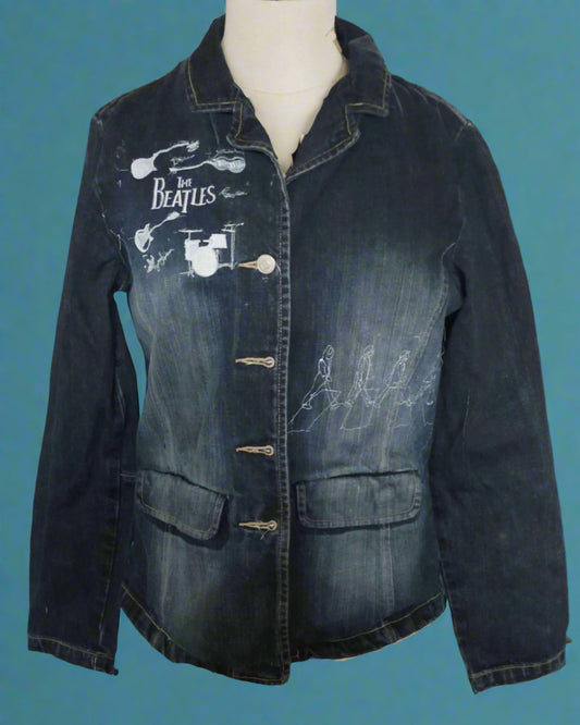 This is a small dark blue denim jacket embellished with images of the Beatles. Made by Not Your Nanain Dunedin, New Zealand