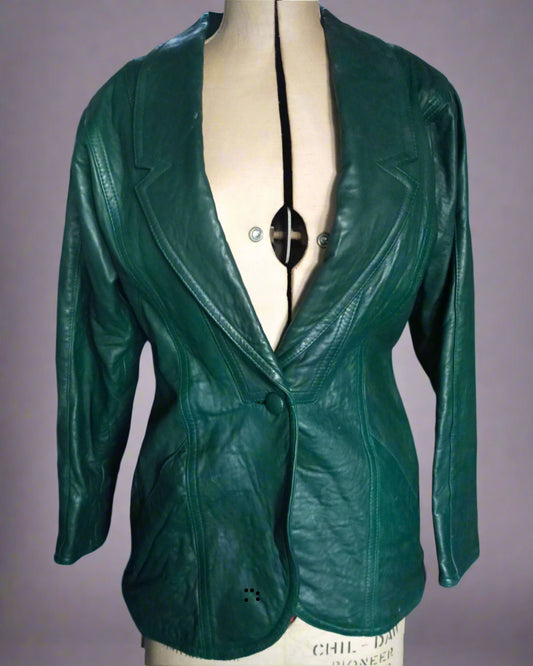 This is a dark green leather designer jacket in blazer style. Found by Not Your Nana in Dunedin, New Zealand.