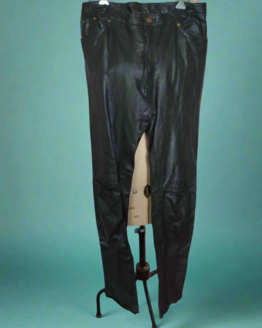 This is a pair of black leather trousers in the style of jeans. Found by Not Your Nana in Dunedin, New Zealand