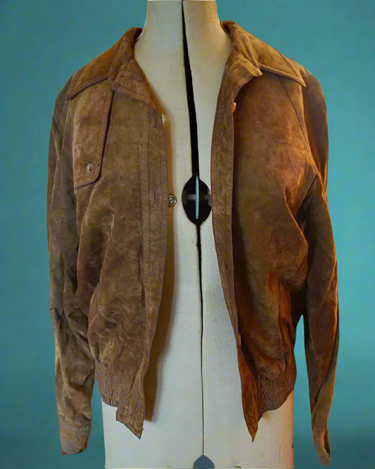 This is a suede bomber jacket fastened with buttons