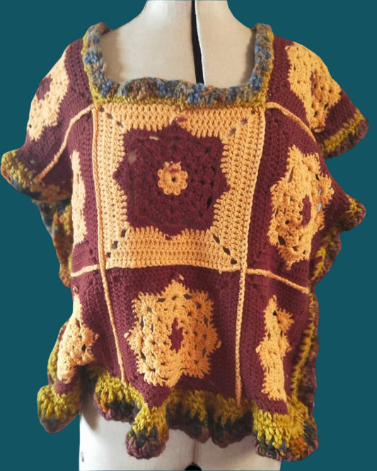 This is a yellow and brown crocheted peggy square top. Made by Not Your Nana in Dunedin,New Zealand.