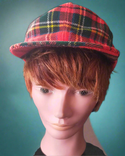 This is a red Stewart tartan flat golf ing cap Made by golfa of Arnold. Found by Not Your ana in Dunedin, New Zealand
