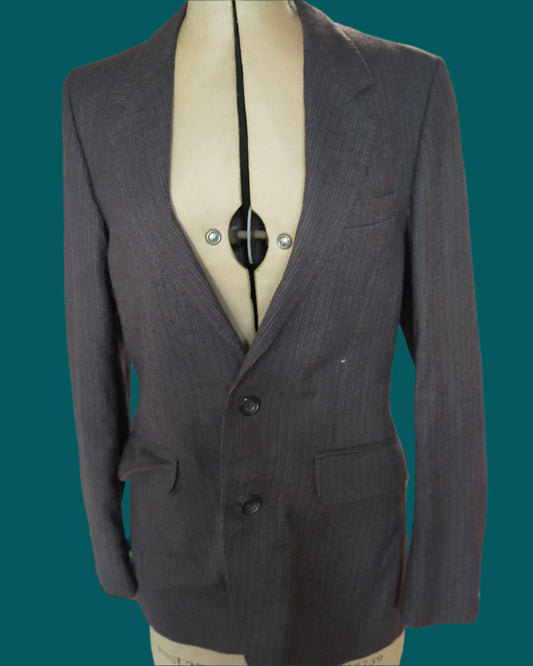 This is a grey pinstripe Pierre cardin jacket. Found by Not Your Nana in Dunedin, New zealand