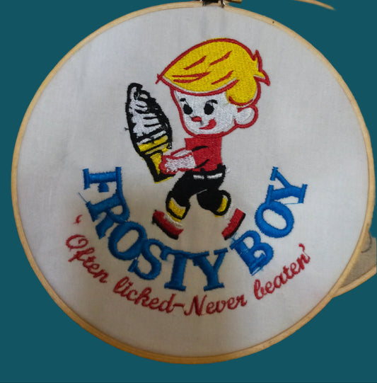 Frosty boy has yellow hair and red and blue clothing. he is carrying an ice cream. Made by Not Your Nana id Dunedin, New Zealand