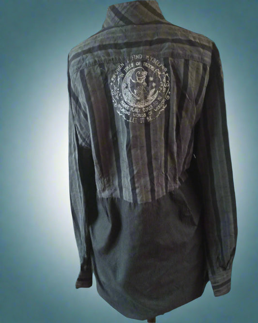 Dark gray shirt with a logo on the back against a transparent background