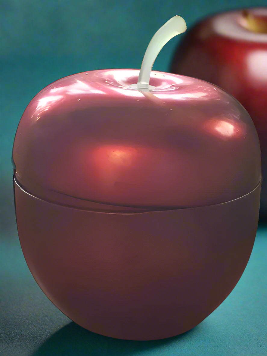 This is a red apple shaped container. Found in DUnedin, New Zealand