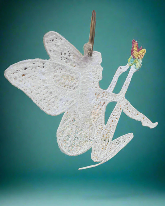 Whitedittinh  lace fairy ornament holding a butterfly made by Dunedin, New Zealand