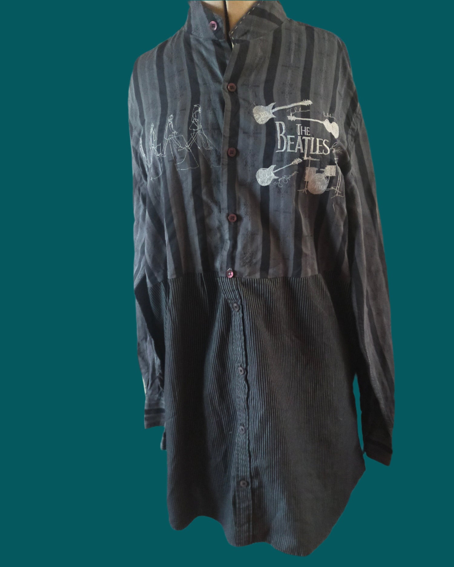 This is a black striped reworked shirt embellished with embroideries of the beatles. Made by nt your nana in Dunedin, New Zealand