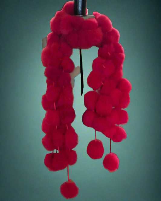 Mannequin with red pom-pom scarf 