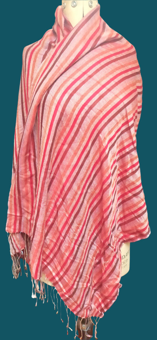 This is a fringed shawl, It is dusty pink with stripes in red, gold and burgundy.