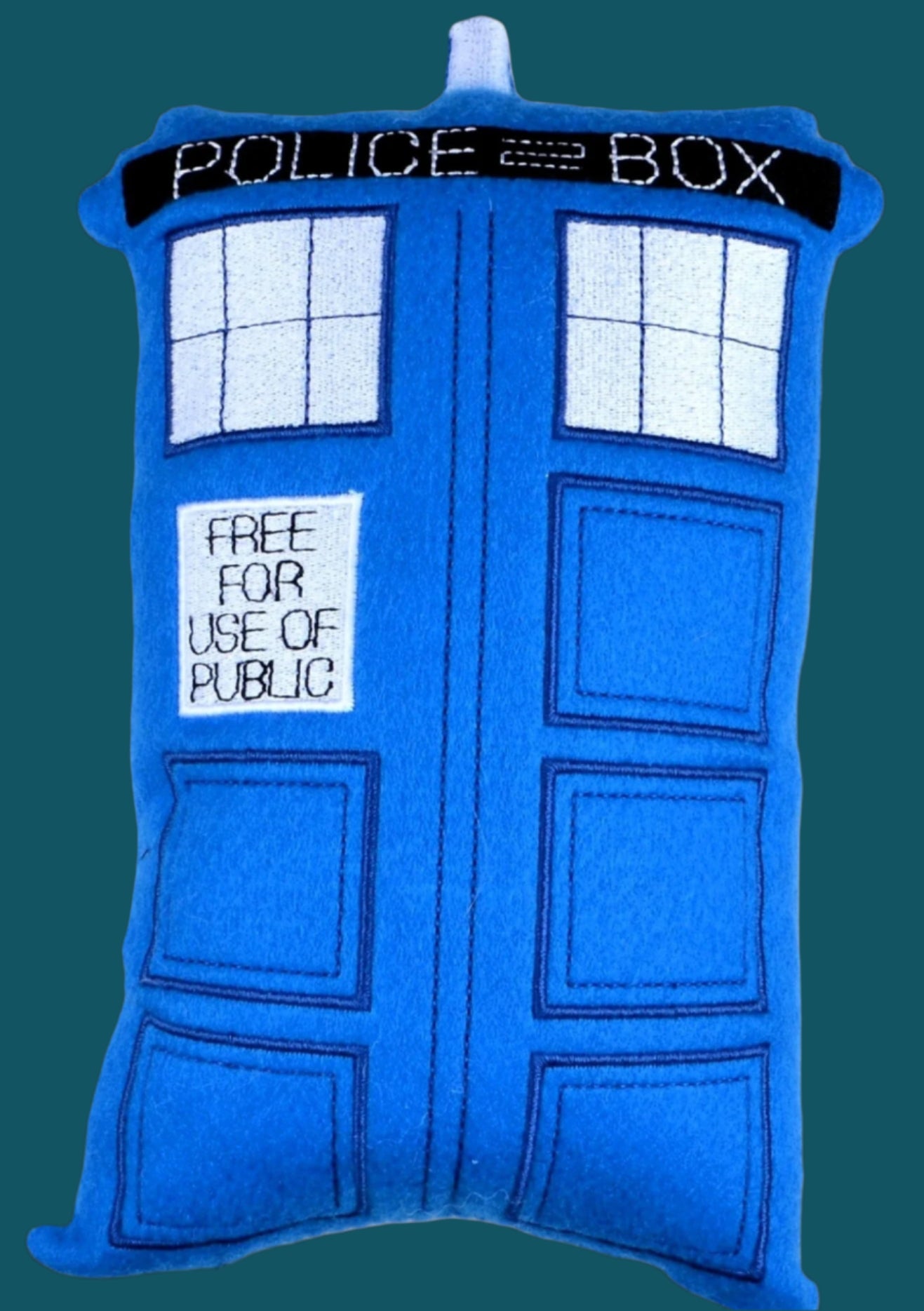This is a blue embroidered soft toy Tardis, part of the Dr Who set. Proudly made in Dunedin, New Zealand